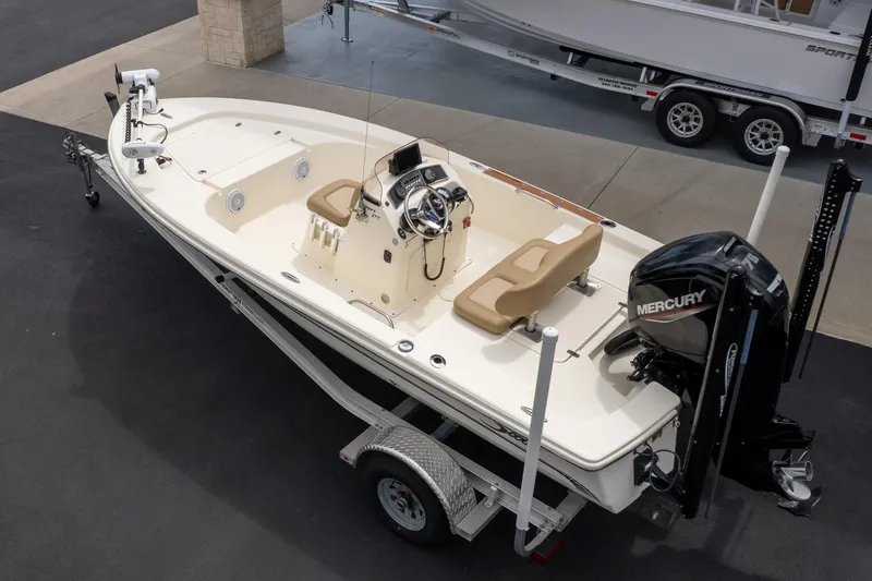 Slide: The Image of 2019 Scout 177 Sportfish Flats boat on trailer with Mercury outboard motor. - 5