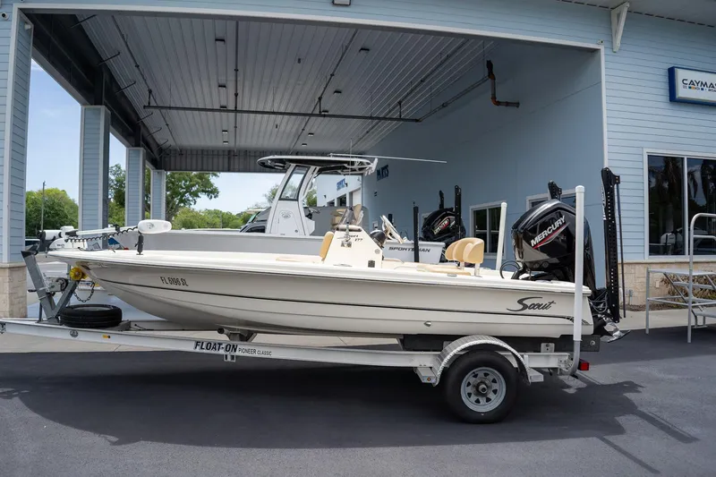 Slide: The Image of 2019 Scout 177 Sportfish Flats boat on trailer, parked outside dealership. - 7