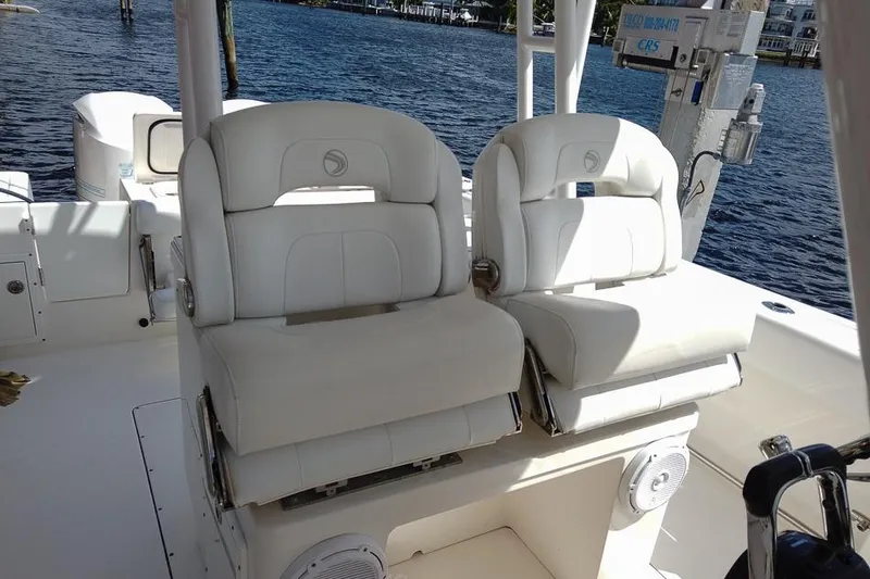 Slide: The Image of Luxurious seating on a 2015 Edgewater 320CC boat with waterfront view. - 14