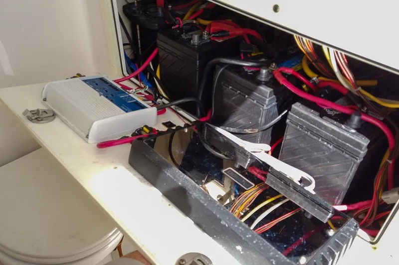 Slide: The Image of Electrical system of a 2015 Edgewater 320CC boat with batteries and wiring. - 17