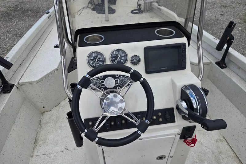 Slide: The Image of 2017 Ranger RB190 Bay boat dashboard with steering wheel, gauges, and navigation system. - 6