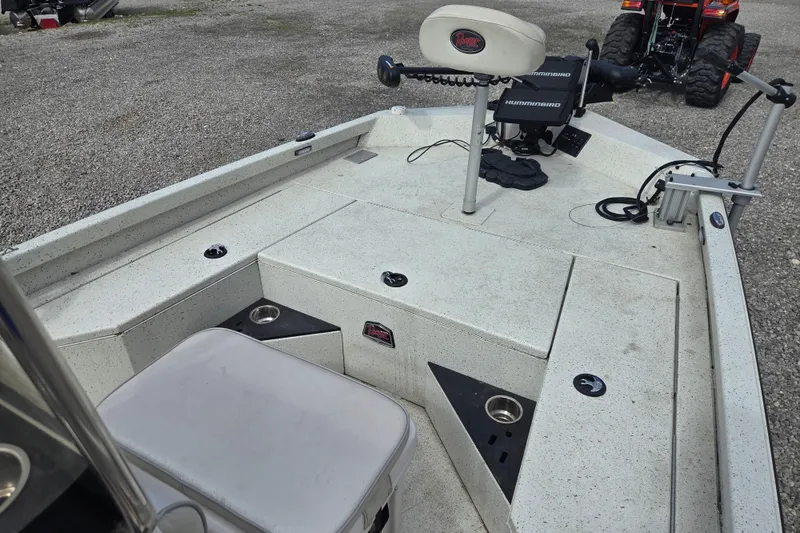 Slide: The Image of 2017 Ranger RB190 Bay boat interior with fishing equipment and seating. - 9