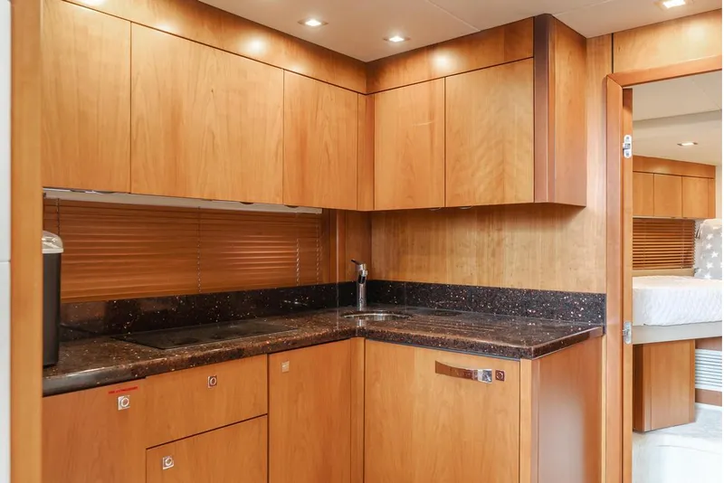Slide: The Image of Luxurious wooden kitchen interior of 2012 Sunseeker Portofino 48 yacht. - 11