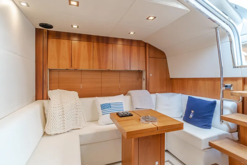 Slide: The Image of Luxurious interior of 2012 Sunseeker Portofino 48 yacht with cozy seating and wooden accents. - 12