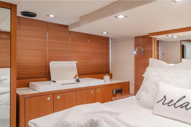 Slide: The Image of Luxurious interior of 2012 Sunseeker Portofino 48 yacht with cozy bedroom and elegant wood finishes. - 15