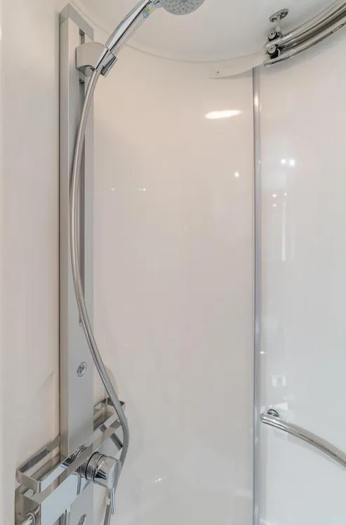 Slide: The Image of Shower area in 2012 Sunseeker Portofino 48 yacht, featuring sleek chrome fixtures. - 22