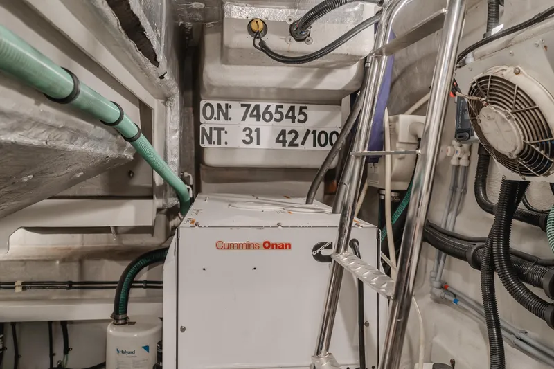 Slide: The Image of Engine room of 2012 Sunseeker Portofino 48 with Cummins Onan generator and equipment. - 25