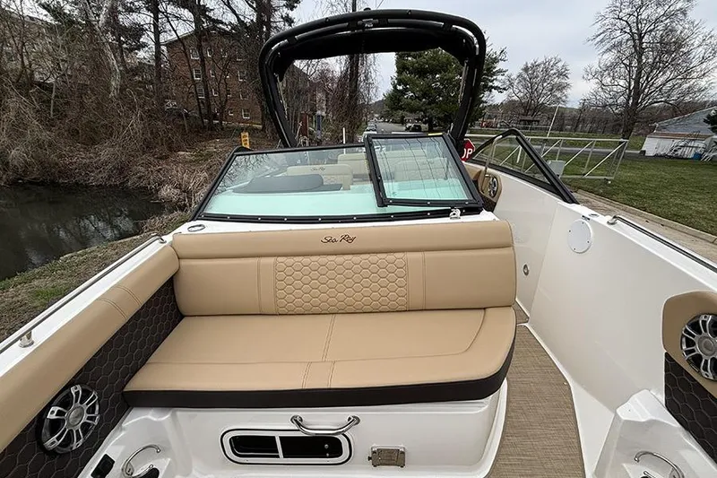 Slide: The Image of 2024 Sea Ray SDX 250 boat interior with tan seating and sleek design. - 29