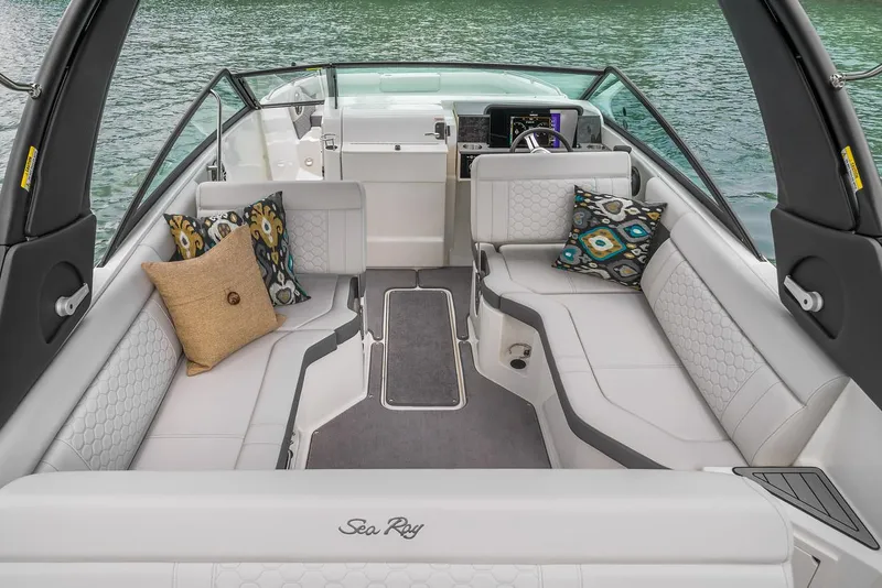 Slide: The Image of Manufacturer Provided Image: 2024 Sea Ray SDX 250 boat interior with plush seating and decorative pillows. - 8