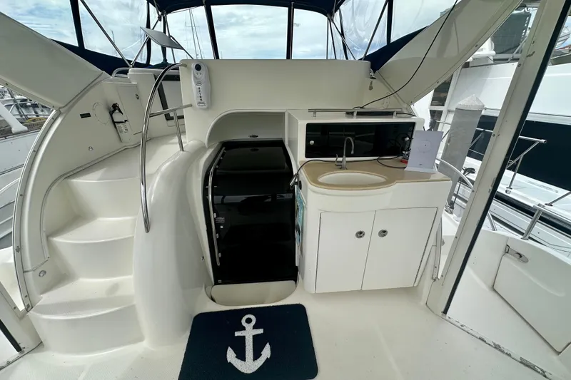 Slide: The Image of 2005 Meridian 459 Motoryacht interior with stairs, sink, and storage cabinets. - 12