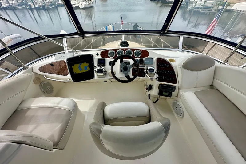 Slide: The Image of 2005 Meridian 459 Motoryacht helm with navigation equipment and comfortable seating. - 14