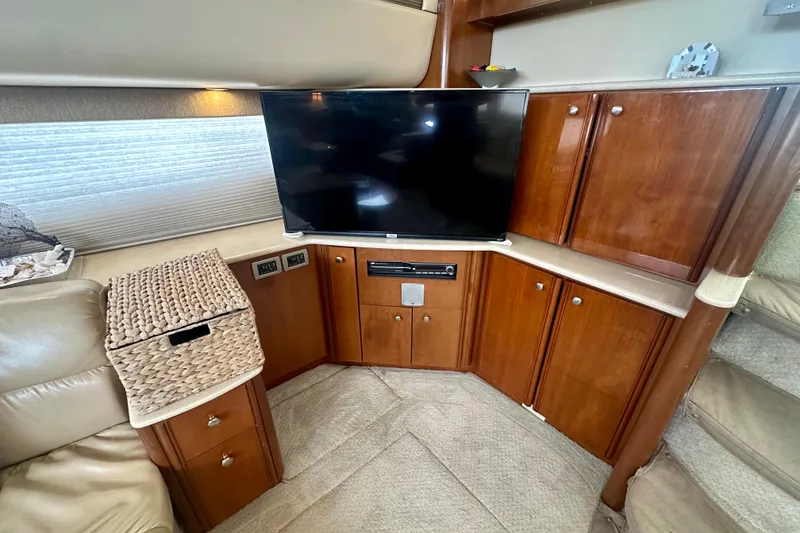 Slide: The Image of Luxurious interior of 2005 Meridian 459 Motoryacht with TV and wooden cabinetry. - 21