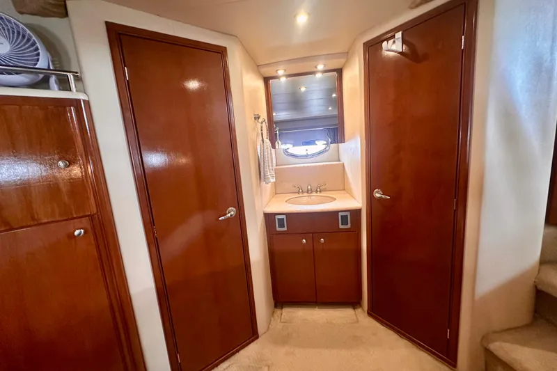 Slide: The Image of 2005 Meridian 459 Motoryacht interior with wooden cabinetry and sink area. - 28