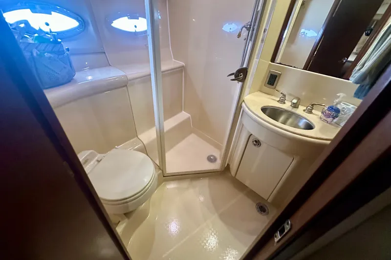 Slide: The Image of Bathroom interior of 2005 Meridian 459 Motoryacht with shower, sink, and toilet. - 33