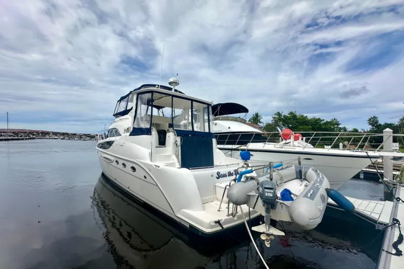 Slide: The Image of 2005 Meridian 459 Motoryacht docked at marina under cloudy sky. - 37