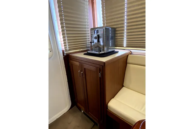 Slide: The Image of Interior of 2007 American Tug 34 with coffee machine on wooden cabinet. - 11
