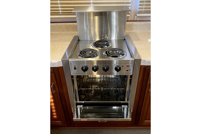 Slide: The Image of Stainless steel stove and oven in 2007 American Tug 34 boat kitchen. - 13