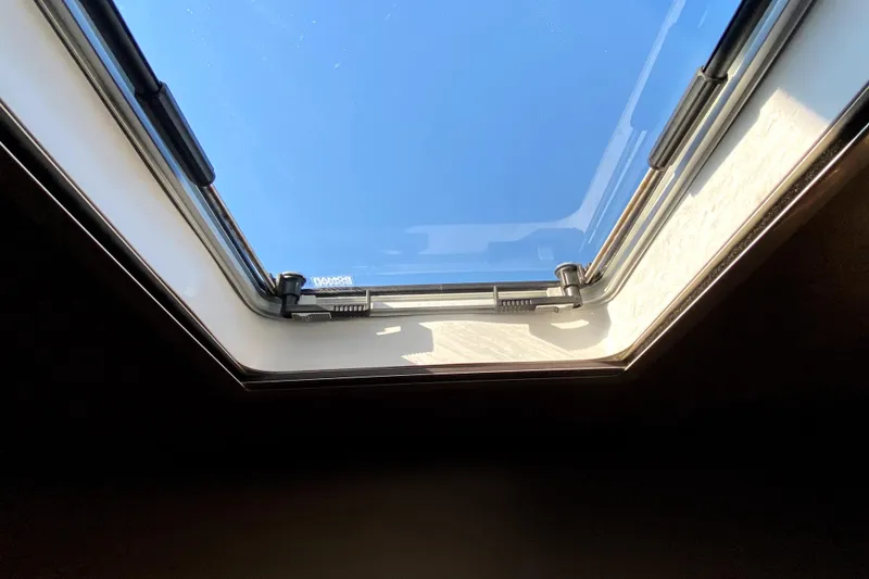Slide: The Image of Skylight view from 2007 American Tug 34, showcasing clear blue sky. - 33