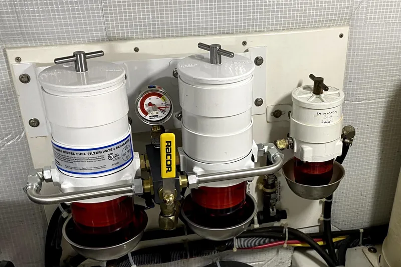 Slide: The Image of Engine room of 2007 American Tug 34 with diesel fuel filters and water separators. - 35