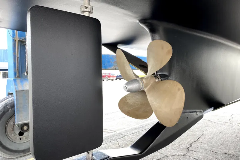 Slide: The Image of Propeller and rudder of a 2007 American Tug 34 boat, showcasing marine engineering. - 40
