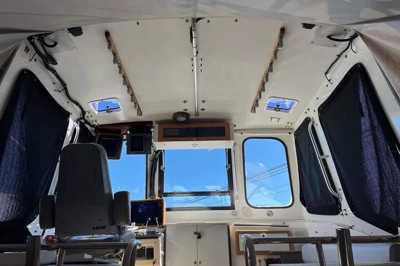 Slide: The Image of Interior view of a 1976 Rare HARRIS 36 EXPRESS boat cabin with modern equipment. - 13