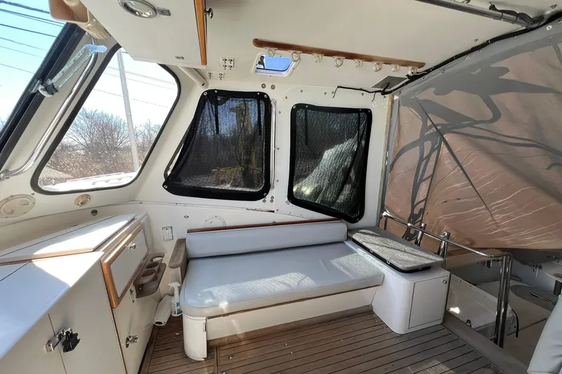 Slide: The Image of Interior of 1976 Rare HARRIS 36 EXPRESS boat with seating and wooden flooring. - 16