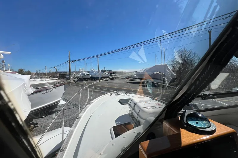 Slide: The Image of 1976 Rare HARRIS 36 EXPRESS boat docked, view from cockpit, clear blue sky. - 19