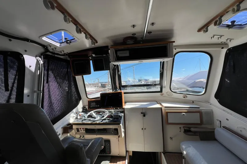 Slide: The Image of Interior of 1976 Rare HARRIS 36 EXPRESS boat with helm and navigation equipment. - 21