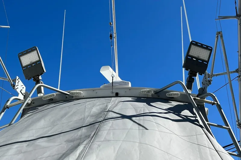 Slide: The Image of 1976 Rare HARRIS 36 EXPRESS boat deck with antennas and lights against blue sky. - 24