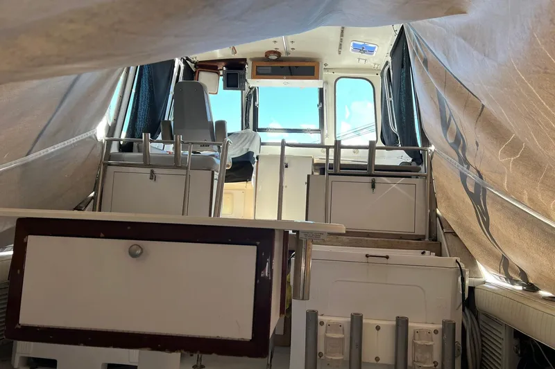 Slide: The Image of Interior view of a 1976 Rare HARRIS 36 EXPRESS boat, showcasing seating and storage. - 7