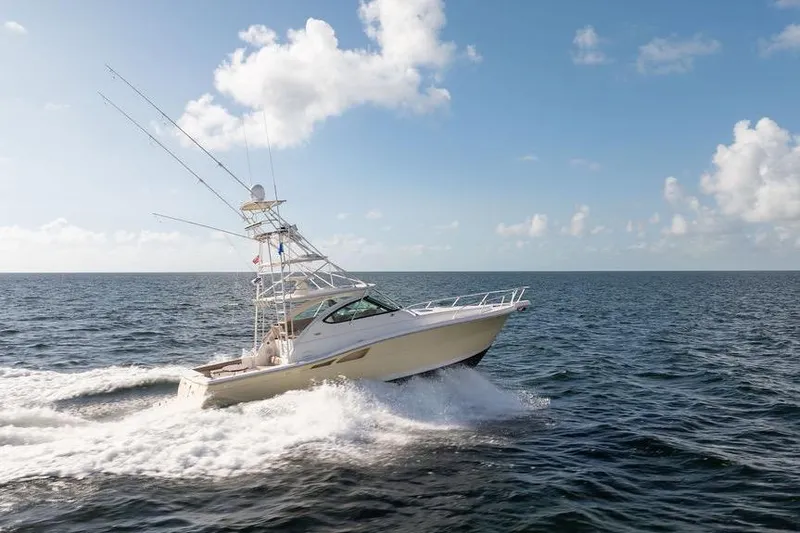 Slide: The Image of 2005 Tiara Yachts 4200 Open cruising on open sea under clear skies. - 10