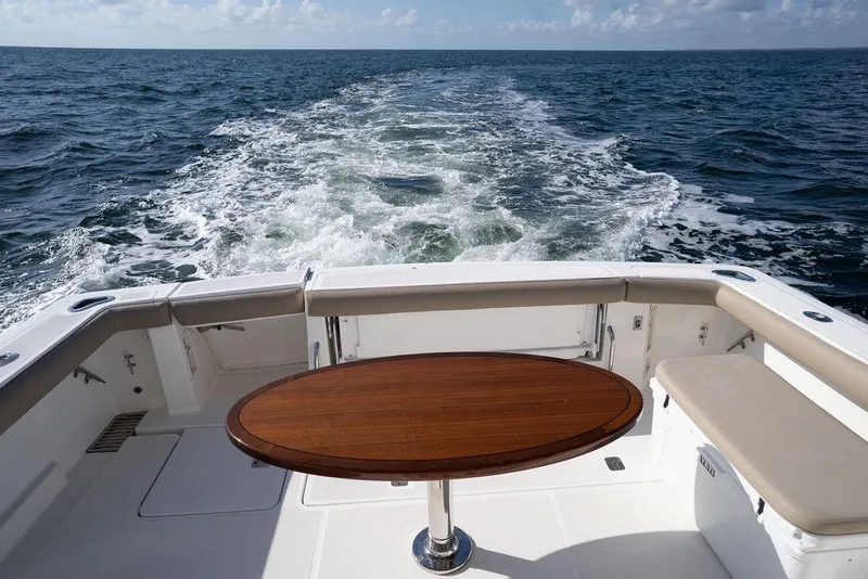 Slide: The Image of 2005 Tiara Yachts 4200 Open, rear deck view with ocean backdrop. - 22