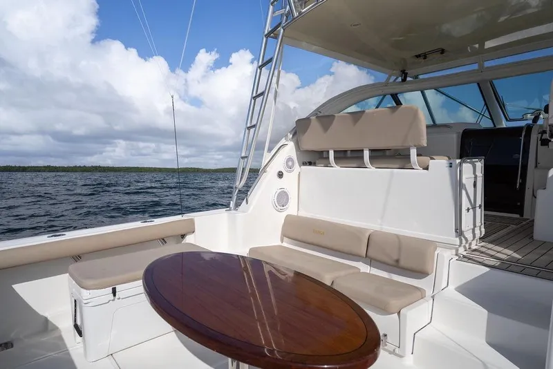 Slide: The Image of 2005 Tiara Yachts 4200 Open with seating area and table on deck, ocean view. - 23