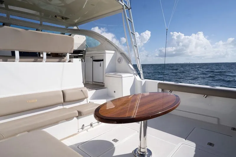 Slide: The Image of 2005 Tiara Yachts 4200 Open interior with seating and ocean view. - 27