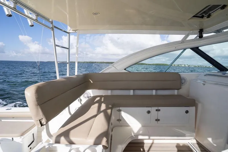 Slide: The Image of 2005 Tiara Yachts 4200 Open interior with beige seating, ocean view. - 28