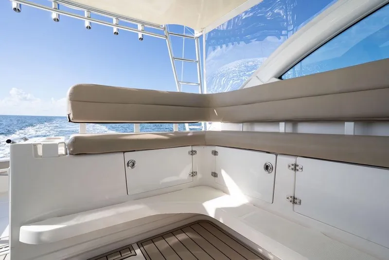 Slide: The Image of 2005 Tiara Yachts 4200 Open interior with cushioned seating and ocean view. - 33