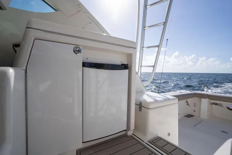 Slide: The Image of 2005 Tiara Yachts 4200 Open deck with ocean view and ladder. - 34