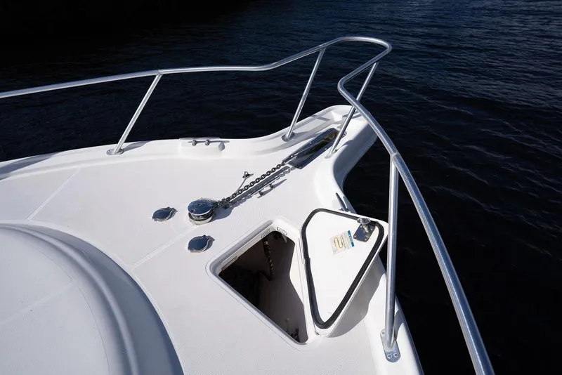 Slide: The Image of Bow of 2005 Tiara Yachts 4200 Open, featuring anchor chain and railing. - 42