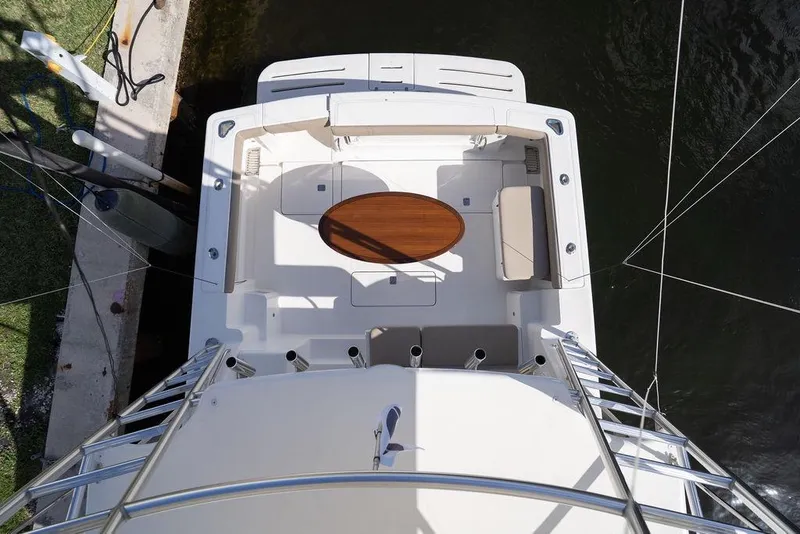 Slide: The Image of 2005 Tiara Yachts 4200 Open, aerial view of deck with seating and table. - 48