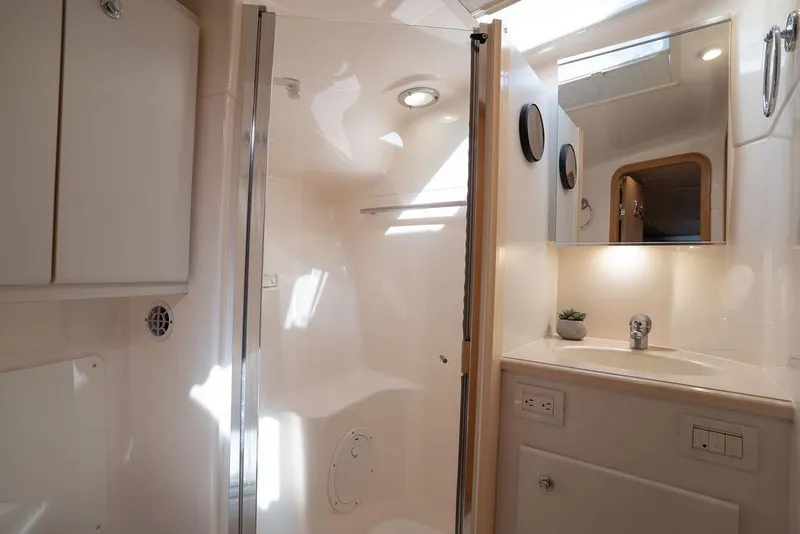 Slide: The Image of Luxurious bathroom interior of 2005 Tiara Yachts 4200 Open, featuring modern fixtures and lighting. - 54