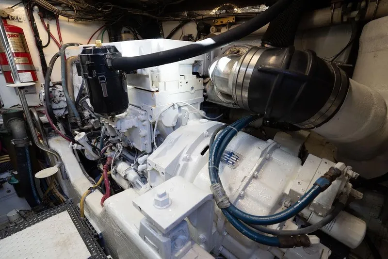 Slide: The Image of Engine room of a 2005 Tiara Yachts 4200 Open, showcasing mechanical components. - 57