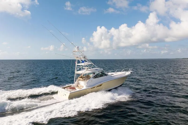 Slide: The Image of 2005 Tiara Yachts 4200 Open cruising on open sea under blue sky. - 6