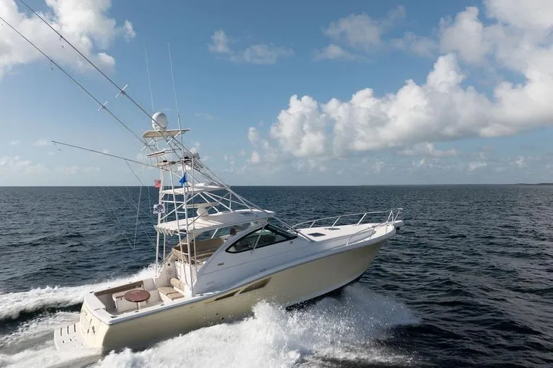 Slide: The Image of 2005 Tiara Yachts 4200 Open cruising on open sea under blue sky. - 7