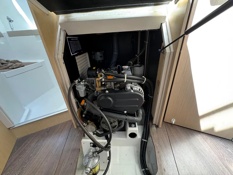 Slide: The Image of Engine compartment of a 2021 Beneteau Oceanis 35.1 sailboat, showcasing mechanical components. - 18