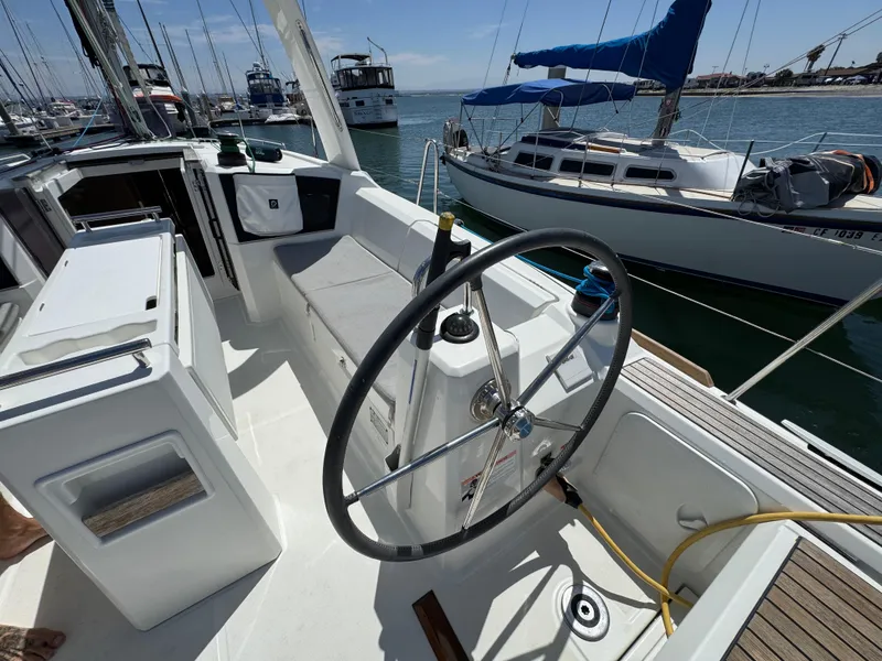 Slide: The Image of Cockpit of a 2021 Beneteau Oceanis 35.1 sailboat docked at a marina. - 9
