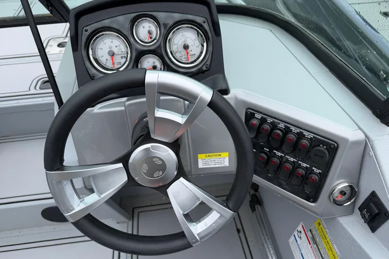 Slide: The Image of Steering wheel and dashboard of 2026 G3 Sportsman 2100 boat. - 8