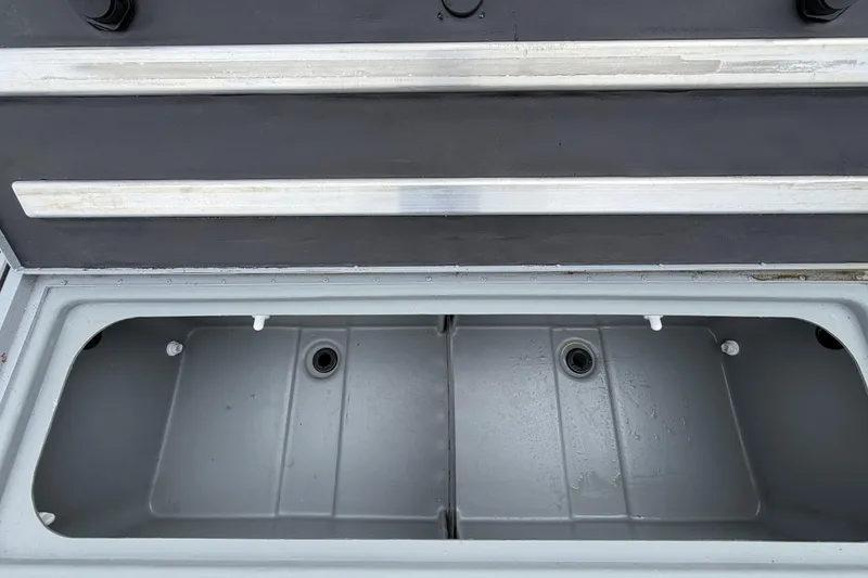 Slide: The Image of Open storage compartment of 2026 G3 Sportsman 2100 boat, featuring a sleek design. - 9