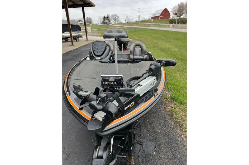 Slide: The Image of 2019 Nitro Z18 fishing boat with trolling motor and seating, parked outdoors. - 6