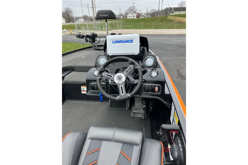 Slide: The Image of 2019 Nitro Z18 boat dashboard with Lowrance display and steering wheel. - 8