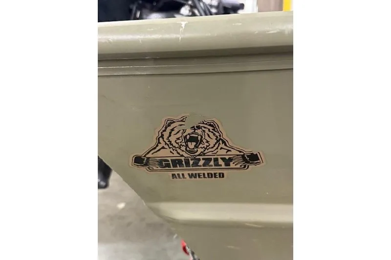 Slide: The Image of 2017 Tracker Grizzly 1754 MVX SC boat with "All Welded" logo detail. - 10